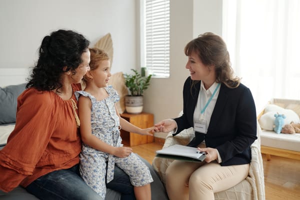 Social Worker Visiting To Single Mom At Home